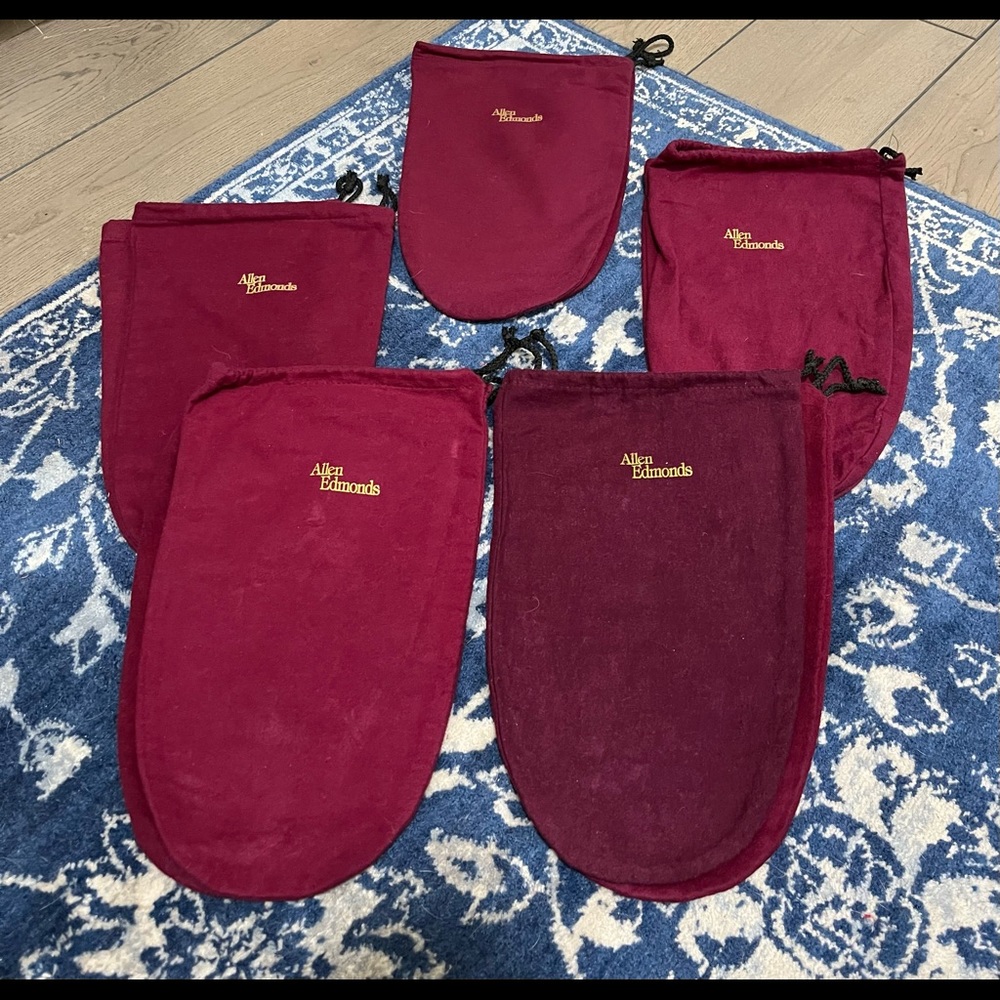 10 red Allen Edmonds shoe bags.